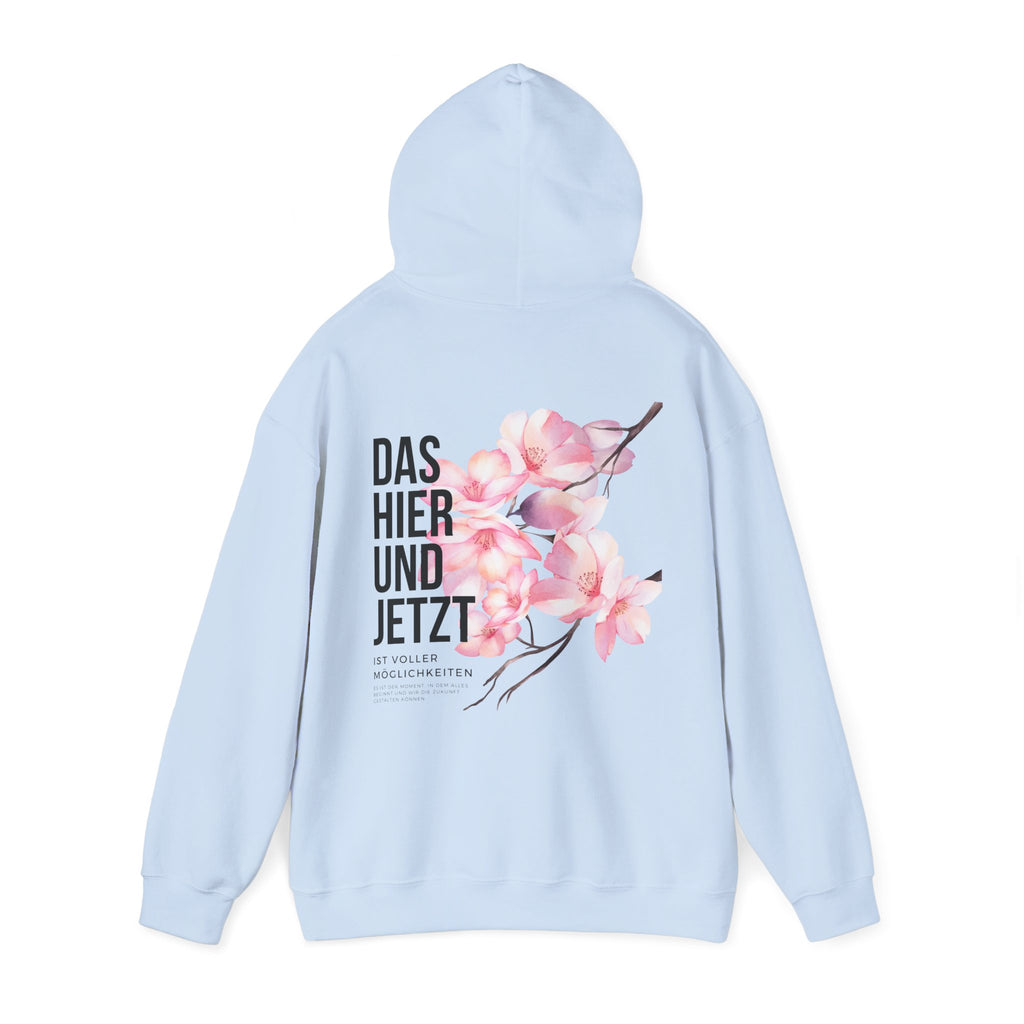 Unisex Hoodie mit Rückenprint „DAS HIER UND JETZT IST VOLLER MÖGLICHKEITEN“ – Hoodie mit inspirierender Botschaft